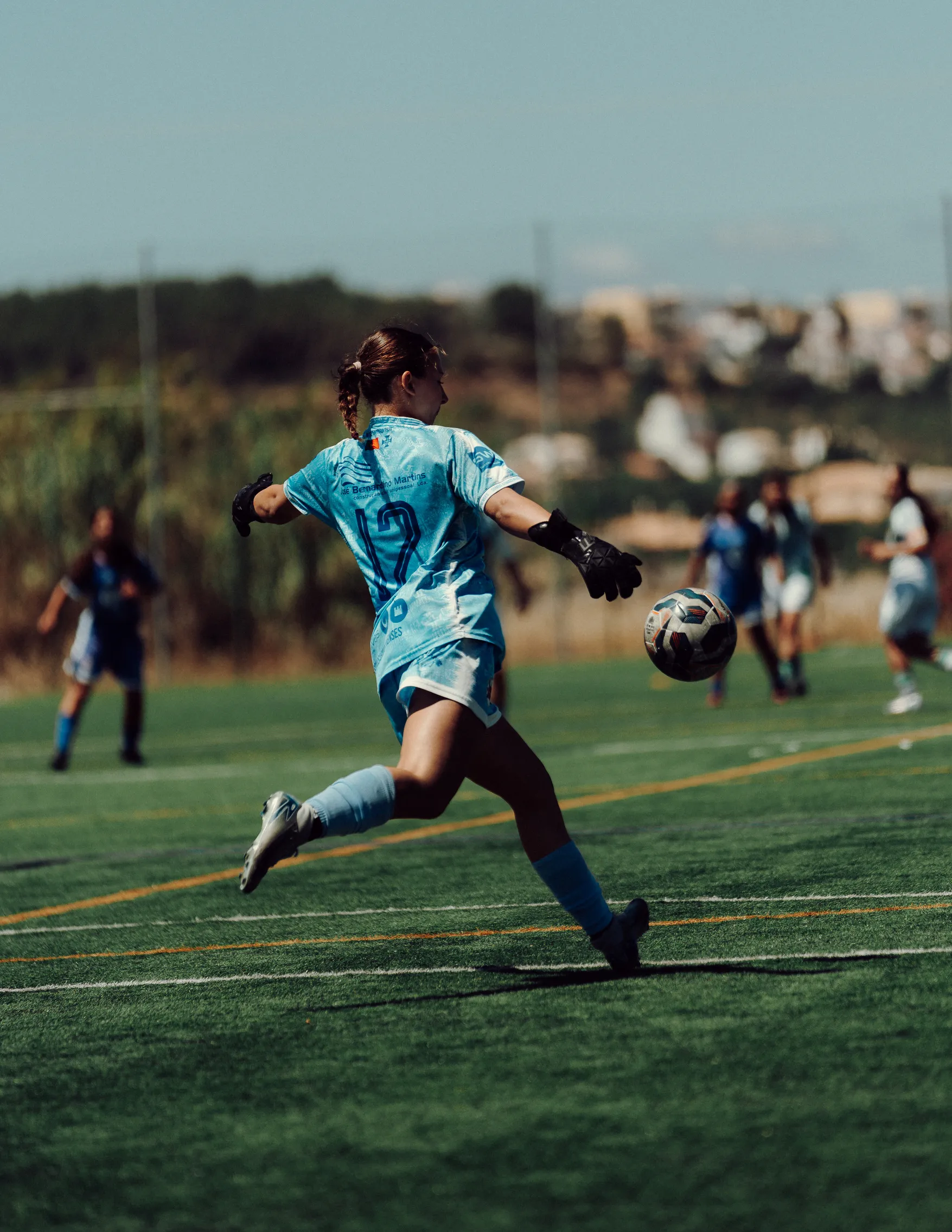 Young players compete for the ball.