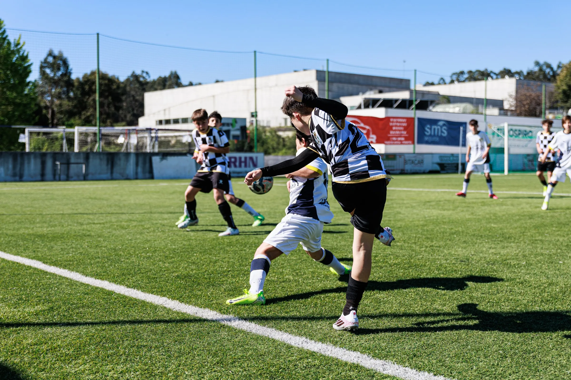 Young players compete for the ball.
