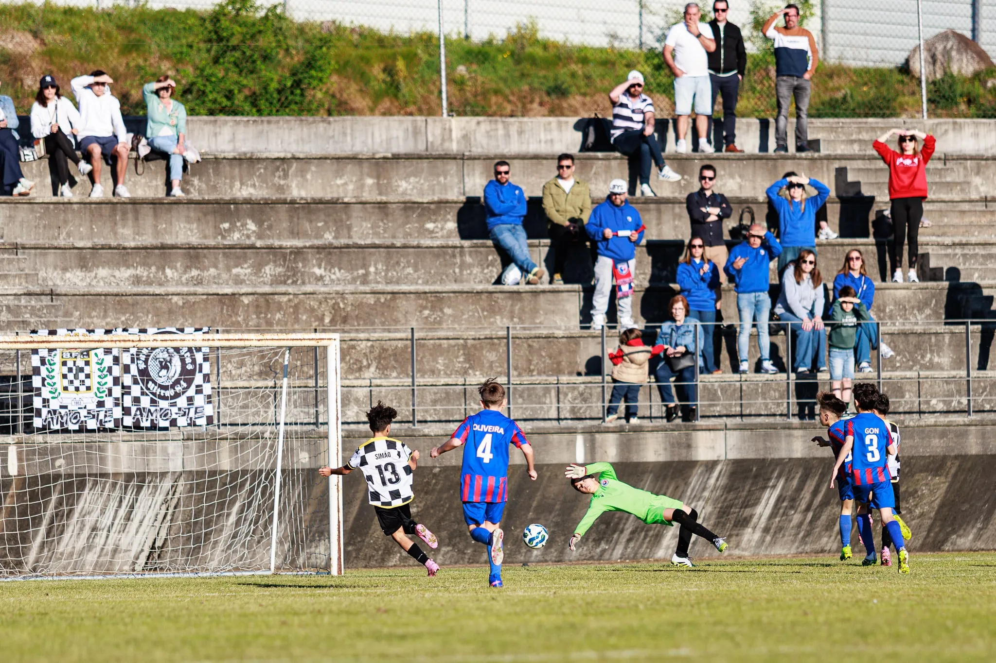A goalkeeper makes a save during the match.
