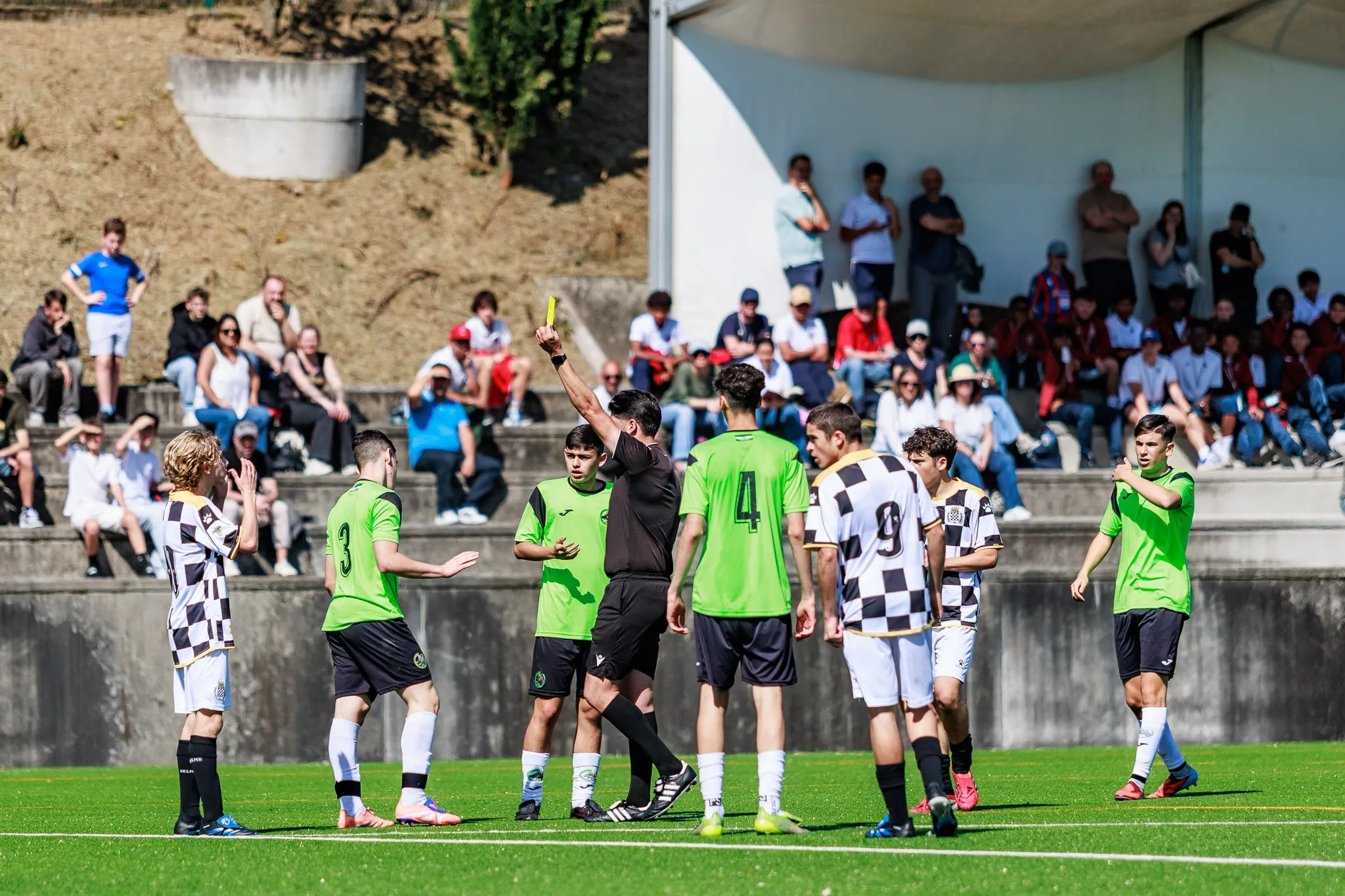 Players greet each other on the pitch.