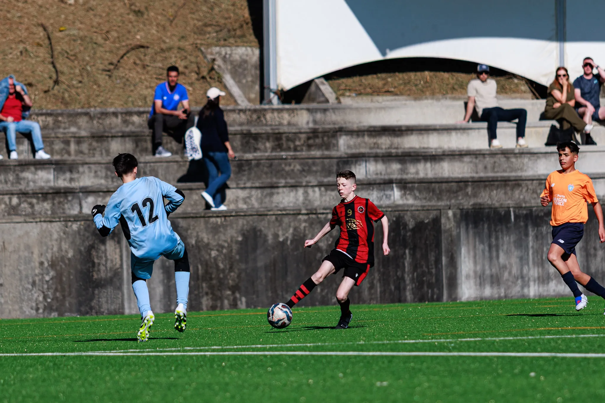 Young players compete for the ball.