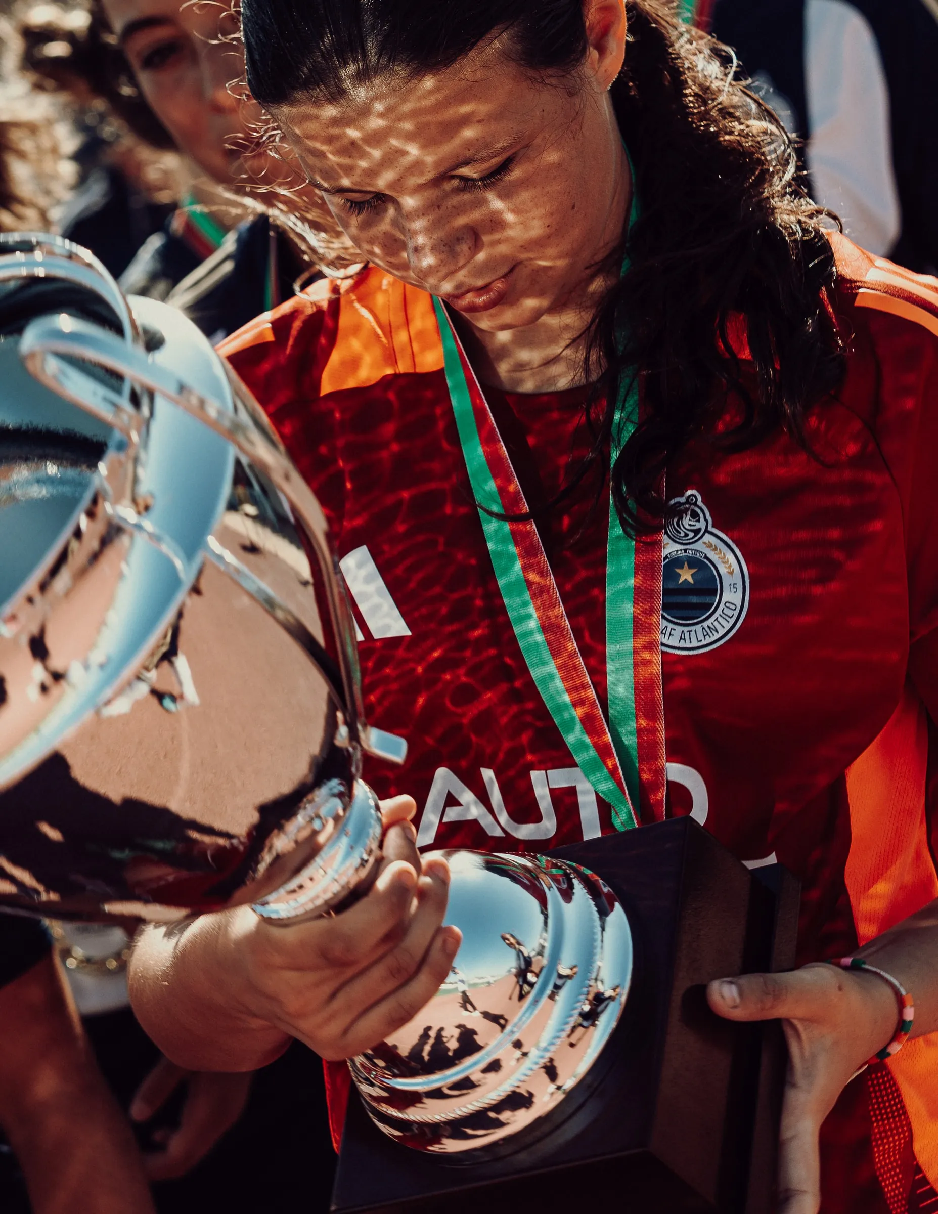 The trophy and the emotion of competition.