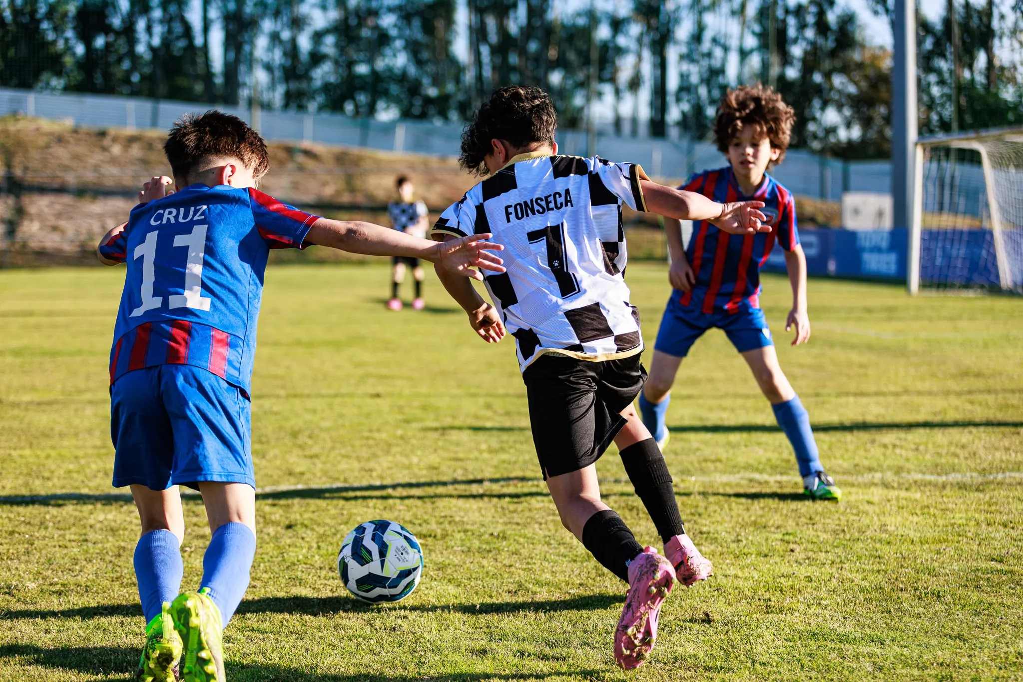 Young players compete for the ball.