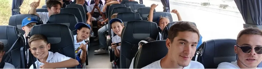 The team travelling by coach.